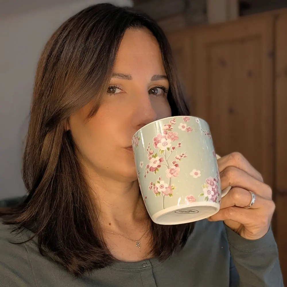 Cheryl Brown, branding consultant, enjoying a quiet coffee moment — authentic lifestyle photo representing Cheryl Brown Branding’s warm and approachable style.