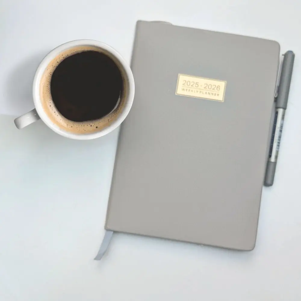 Neutral flat-lay of a 2025–2026 planner